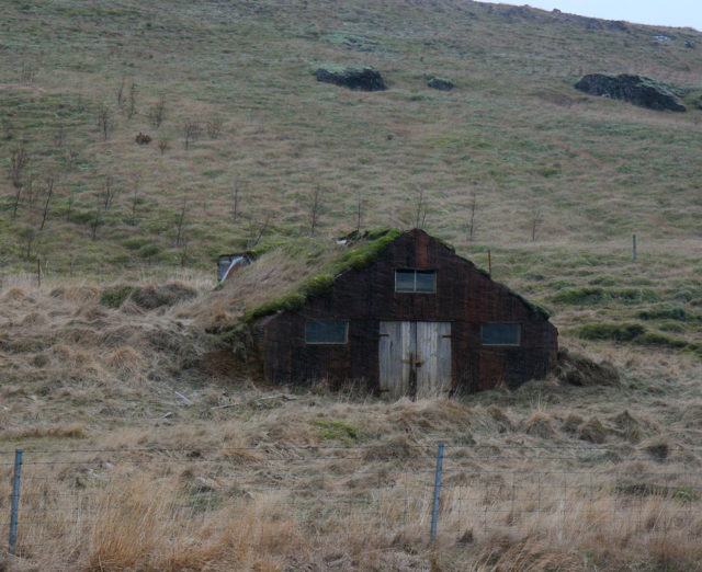 Turf farmhouse near Flúðir, snow falling, Photo Credit