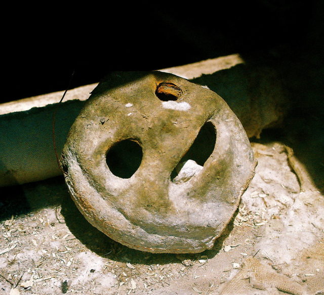 Mask in the window of the Bodie Ghost town school house