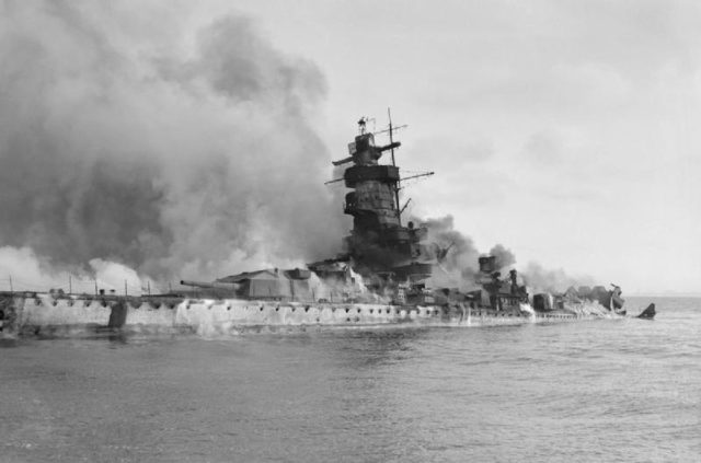 Admiral Graf Spee in flames after being scuttled in the River Plate estuary Photo Credit
