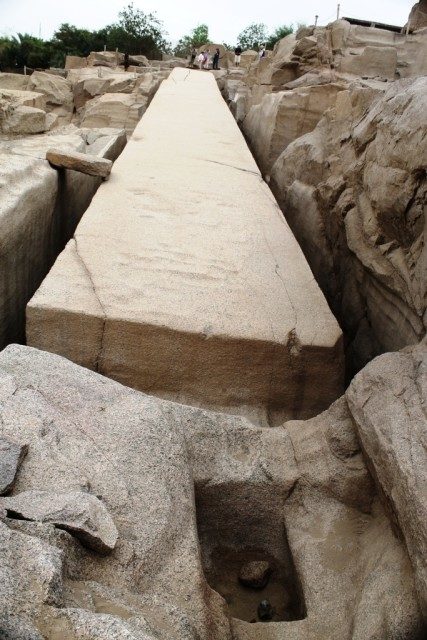It is dumbfounding to think that the main tools used to shape this excessively huge granite block were not chisels as most people would assume. The early Egyptian stone masons used small hand sized balls of the mineral Dolerite to pound against the surfaces of the roughly hewn obelisks, until all the superfluous knobs and excrescences were flattened. Dolerite is one of the few substances on Planet Earth that is harder than granite, most other rocks would simply crumble if they were repeatedly banged against granite. Photo Credit