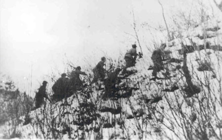 Soldiers from the Chinese 79th Division moving to engage the Marines at Yudam-ni. Photo Credit