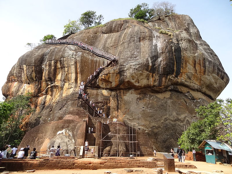 People walking the stairs up Sigiriya.