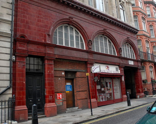 The station features a red glazed terracotta façade common to most built by the UERL. Photo Credit