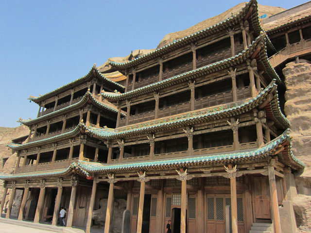 The wooden buildings extant in front of caves 5 and 6 were constructed in 1621, during the early Qing Dynasty. Photo Credit