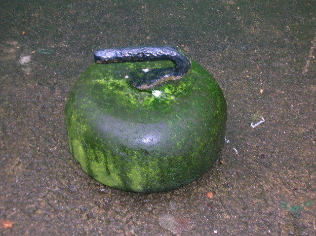 An old-style curling stone Photo Credit 