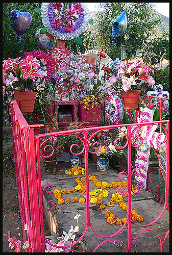 A grave decorated for the Day of the Dead. Photo Credit