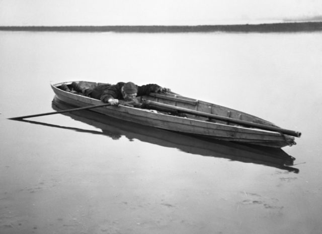 1910. A punt and punt gun. . Photo Credit 