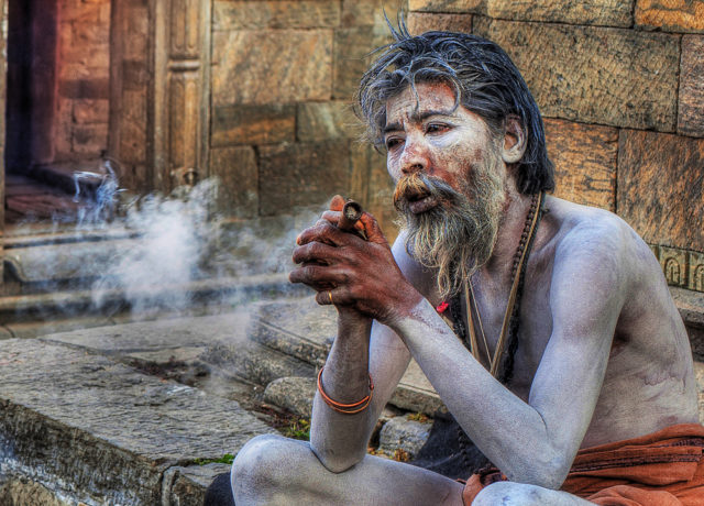 An Aghori ascetic smoking marijuana. Photo Credit