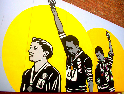 Peter Norman, and African American athletes Tommie Smith and John Carlos in a mural in Burnett Lane, Brisbane. Photo Credit