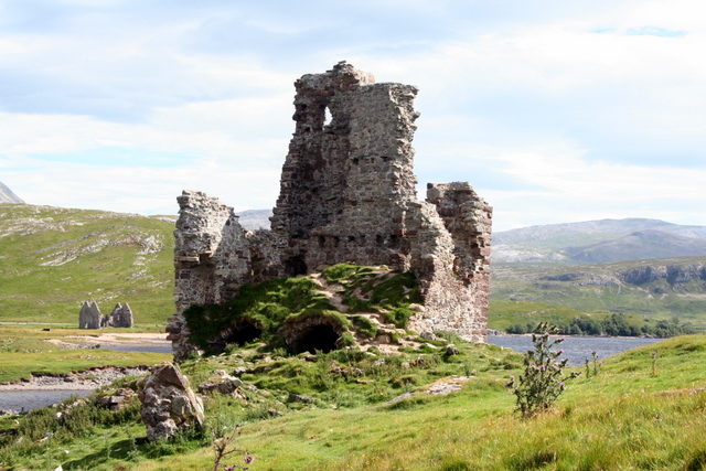 View from the west end of the peninsula to Ardvreck Castle. In the background - the ruins of Calda House. Photo credit