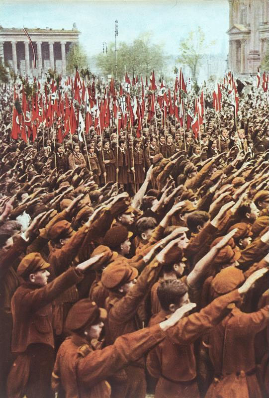 Hitler Youth members performing the Nazi salute at a rally at the Lustgarten in Berlin, 1933. Photo Credit