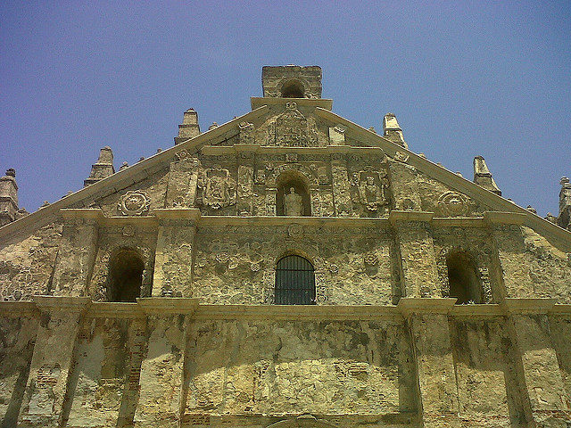 Facade is made of brick on the lower level and coral stones on the upper level. Photo Credit