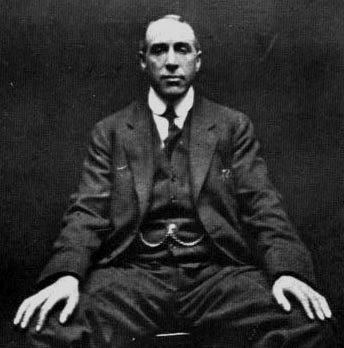 A photograph of paranormal investigator Harry Price, taken by spirit photographer William Hope in 1922.