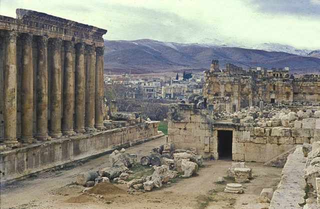 The Temple of Bacchus (left) and the medieval fortifications of Baalbek in front of the city in 1959. Photo Credit