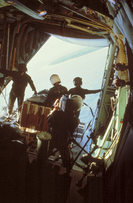 WC-130 of the 54th Weather Reconnaissance Squadron out of Guam, circles around for the airdrop in 1986. Photo Credit