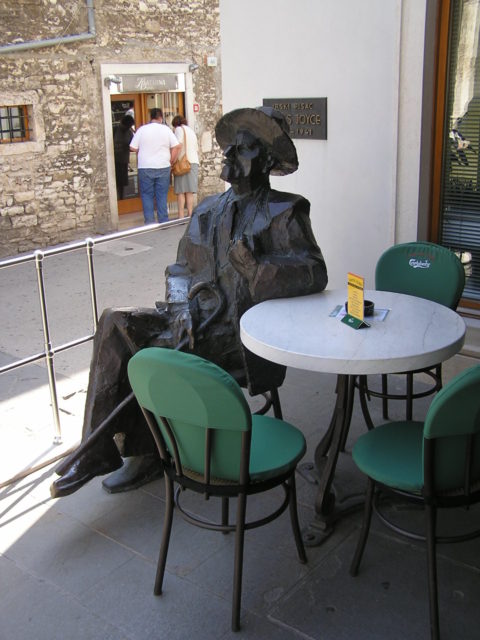 Sculpture of Joyce at a table on the terrace of the cafe Uliks. Photo Credit