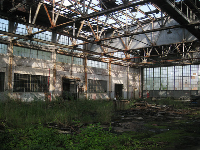 Inside an abandoned hangar. Photo Credit 