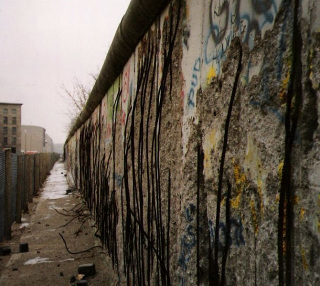 A view of the East side of the Berlin Wall, taken in 1990 (after the border was opened).. Photo Credit