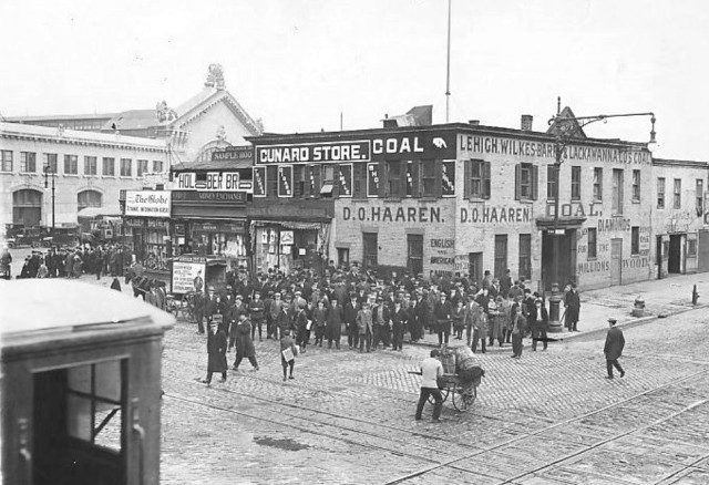 Crowds gathered at the Cunard Pier-Pier 54-in New York where the Carpathia landed with survivors of the Titanic disaster. Photo Credit