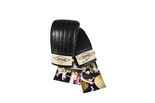 Ali's signed Ringmaster training glove with supporting photographs.