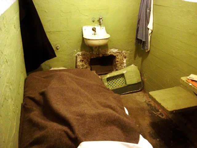 Escapee’s prison cell, with widened vent opening beneath the sink