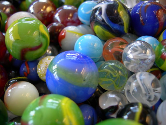 Marbles of different sizes and types. Photo Credit