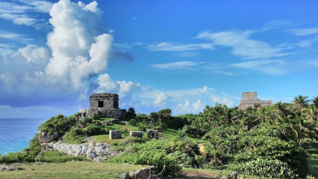 Temple of the God of Wind (left) and Castillo (right). Photo Credit