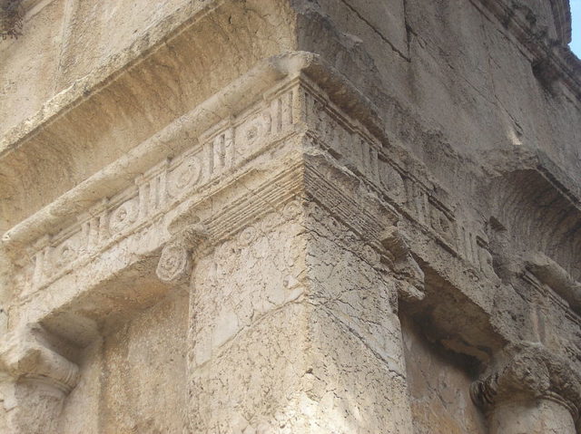 The four square facades are crowned by a Doric frieze of triglyphs and metopes and an Egyptian cornice. Photo Credit