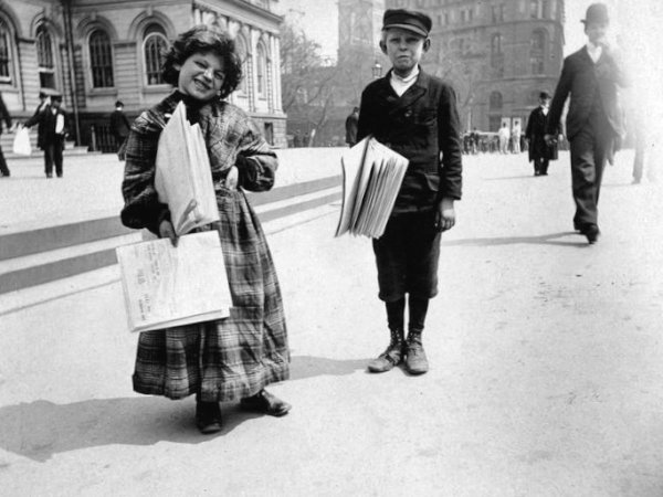 Newsgirl and newsboy. Photo Credit