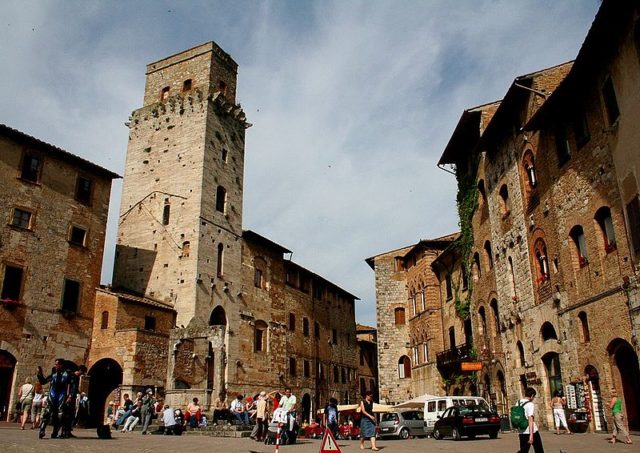 Piazza Cisterna, the main square in San Gimignano, Italy. Photo Credit