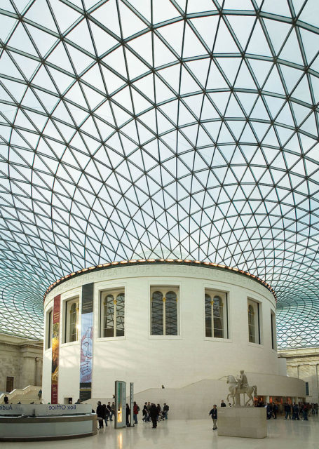 The Great Court of the British Museum, with the new tessellated roof designed by Foster and Partners arching around the original, circular, Reading Room of the British Library. The sculpture on the pedestal on the right-hand foreground is a youth on horseback from 1st century AD Rome. Photo Credit