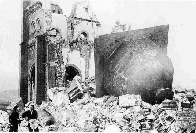 Urakami Tenshudo (Catholic Church in Nagasaki), destroyed by the bomb, with the dome/bell of the church, to the right, having toppled off.