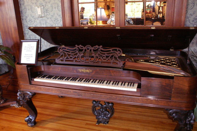 An antique Chickering piano  Photo Credit