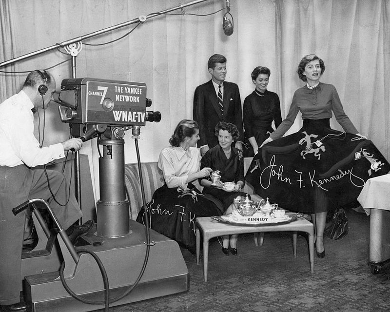 Photo of the Kennedy family promoting their “Kennedy Teas” during the 1952 campaign for US Senate in Massachusetts at WNAC-TV, Boston. Pictured are John F. Kennedy, Rose Kennedy, Eunice Kennedy, Patricia Kennedy, and Jean Kennedy.