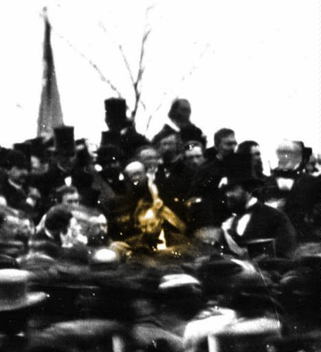Abraham Lincoln at Gettysburg (seated center, highlighted in sepia). Ward Hill Lamon is seated to Lincoln’s right.