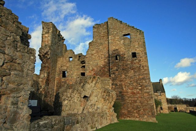 Ruins of the castle with the central range behind. Photo Credit