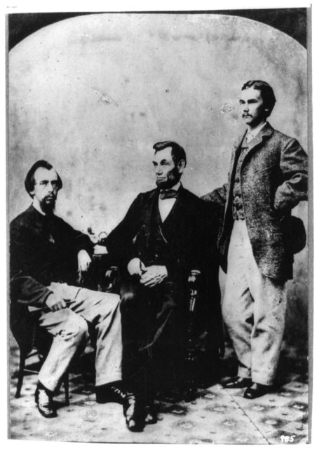 President Abraham Lincoln and his two secretaries, John Nicolay (left) and John Hay (right)