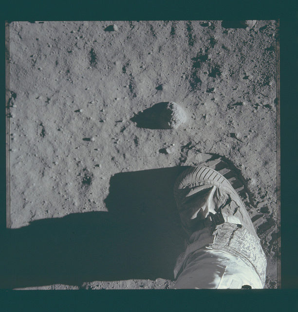 Neil Armstrong put his left foot on the rocky Moon.
