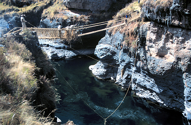 Lashing the hand-ropes to the main side cables. Photo Credit