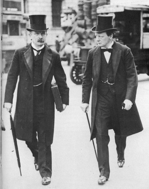 David Lloyd George and Winston Churchill. Wearing frock coats and top hats in 1907 during the peak of their “radical phase” as social reformers. A fabulous example of early 20th era men’s fashion