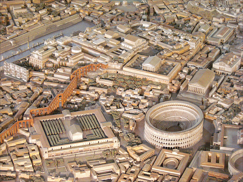 The Temple of Claudius to the south (left) of the Colosseum (model of Imperial Rome at the Museo della Civiltà Romana in Rome). Photo Credit