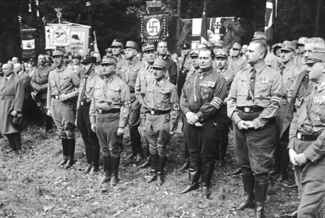 The founding of the Harzburg Front: camp service of the NSDAP delegation, in the first row Himmler, Röhm and Göring  Photo Credit