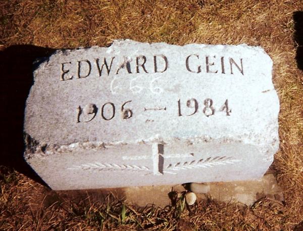 Ed Gein’s vandalized grave marker as it appeared in 1999 before thieves stole it.