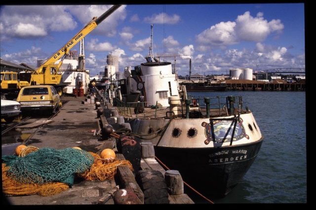 Rainbow Warrior docked in Auckland in December 1985 after it was recovered from the bottom. The ship was deemed beyond repair and scuttled near the Cavalli Islands, where it serves as a dive wreck and fish sanctuary / Photo credit