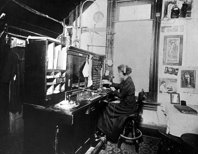 Telephone operator, c. 1900.