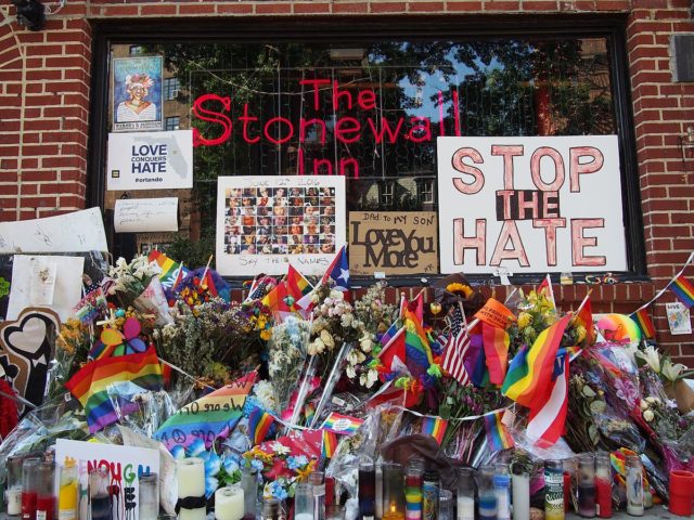 A memorial for the 2016 Orlando nightclub shooting covers the exterior on Pride weekend 2016. photo credit