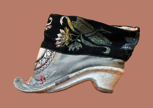 A lotus shoe for bound feet. The ideal length for a bound foot was 3 Chinese inches (寸), which is around 4 inches (10 cm) 