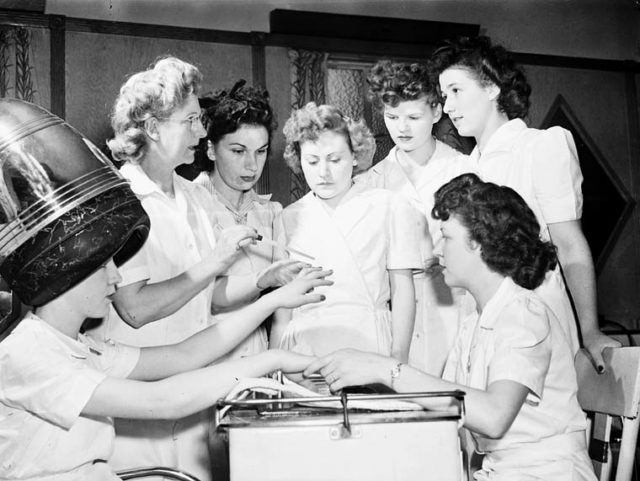 Ex-servicewomen learning manicure techniques during a retraining course on beauty parlor operation at the Robertson Hairdressing School, Apr 1945   Photo Credit
