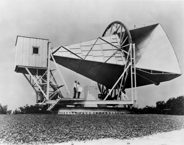 Photo of the 15 meter Holmdel horn antenna at Bell Telephone Laboratories in Holmdel, New Jersey. The site helped the pioneering work in communication satellites for the NASA Echo project’s “satelloons.” 50 feet in length, and weighing 18 tons, the structure was comprised of aluminum with a steel base