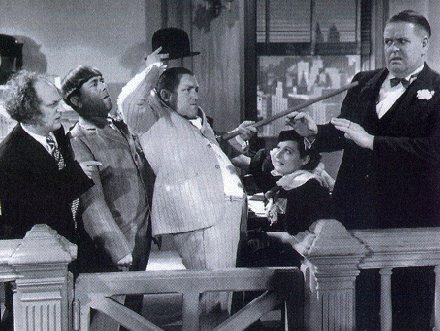 Larry Fine, Moe Howard and Curly Howard in Disorder in the Court (1936), one of three frequently telecast Stooges shorts in the public domain.